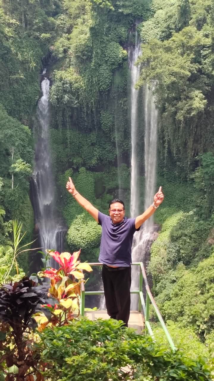 Guide at a jungle waterfall viewpoint in Bali
