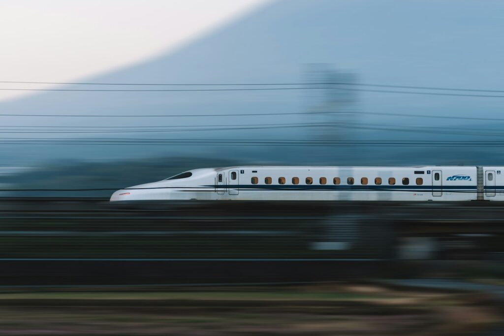 Shinkansen bullet train passing Mount Fuji, Japan