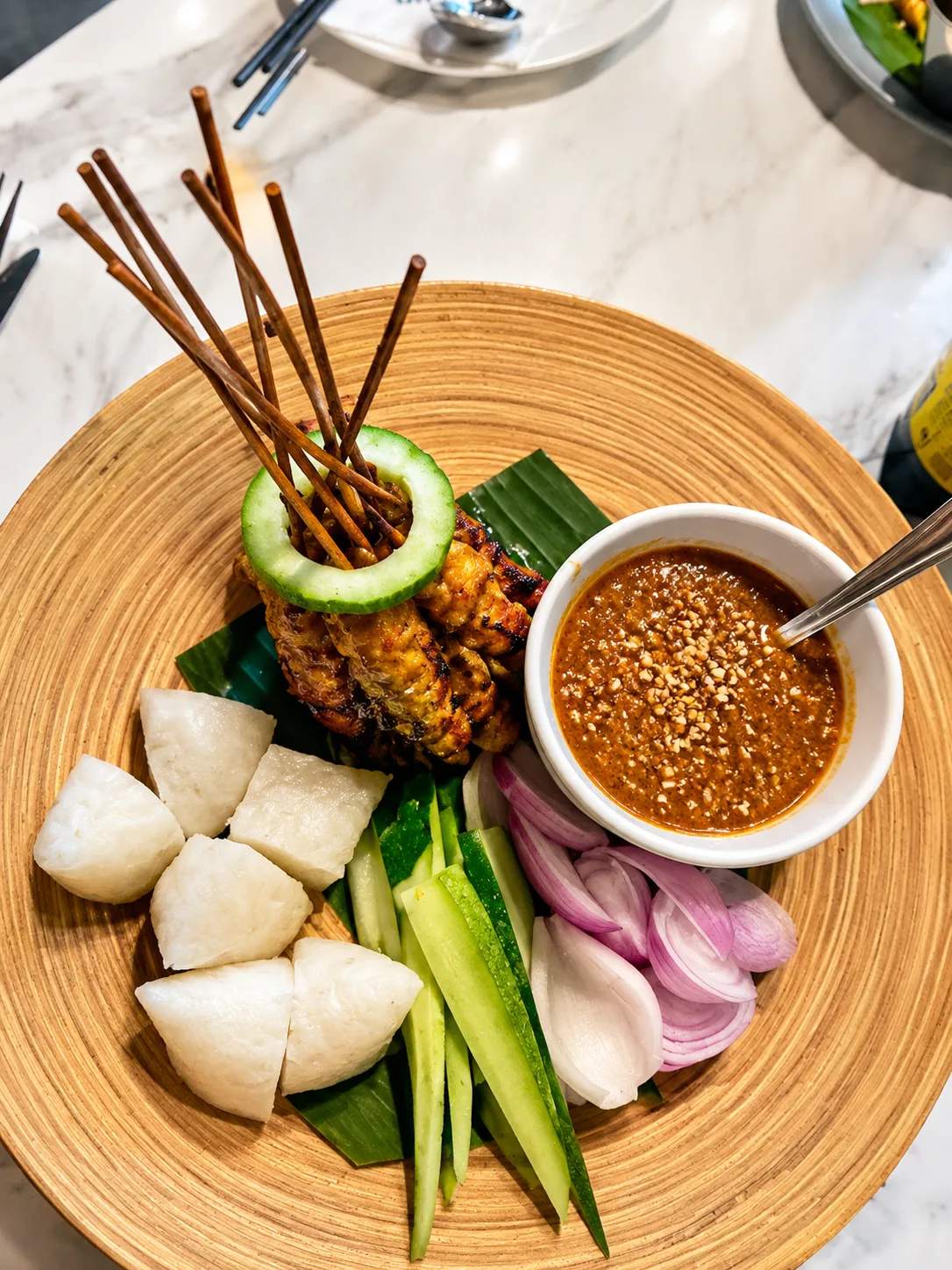 Mixed satay with peanut sauce, cucumber, onion and rice cakes at WIP on the Park, Kuala Lumpur
